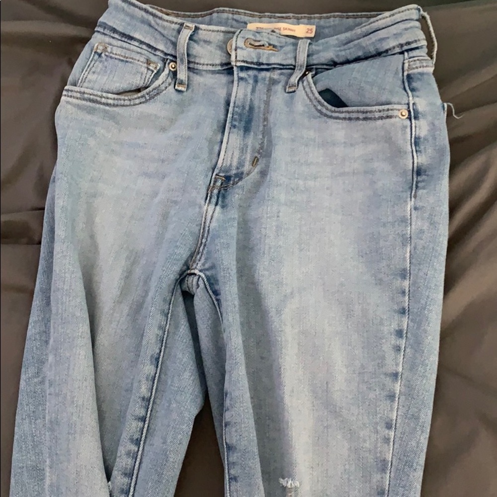 Light blue ripped jeans